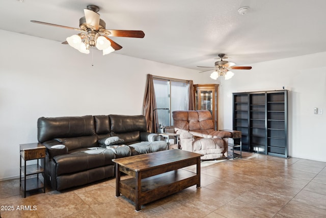 living area featuring a ceiling fan