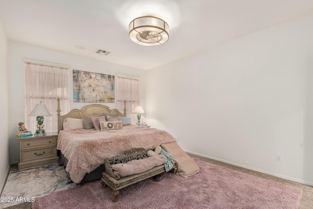 bedroom with baseboards, visible vents, and carpet floors