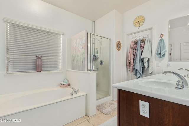 full bath with a bath, vanity, tile patterned flooring, and a shower stall