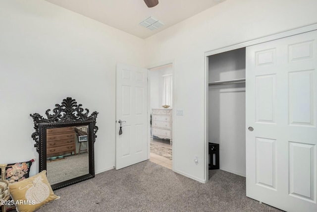 bedroom with visible vents, a ceiling fan, a closet, baseboards, and carpet flooring