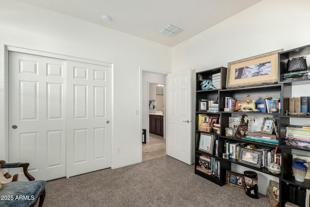 interior space featuring carpet and visible vents