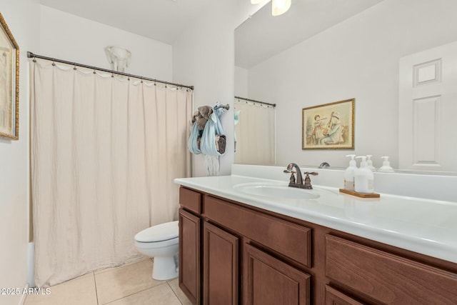 bathroom featuring toilet, shower / tub combo with curtain, vanity, and tile patterned floors