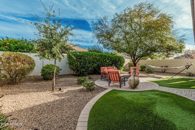 view of yard with a fenced backyard and a patio