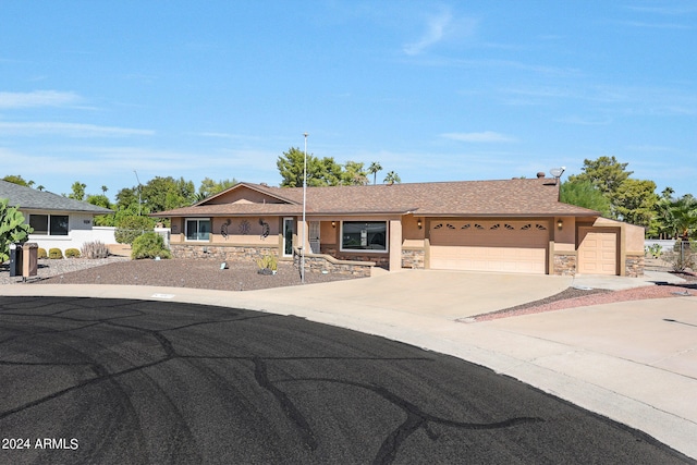 ranch-style home featuring a garage