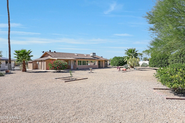 back of property featuring a patio