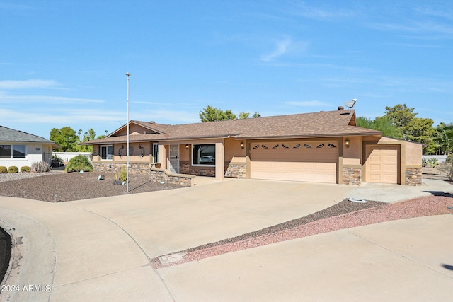 ranch-style house featuring a garage