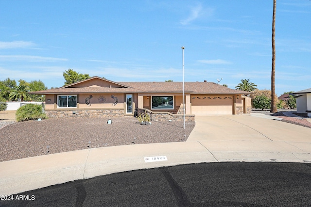 single story home with a garage