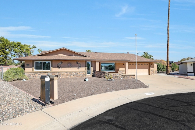 single story home with a garage