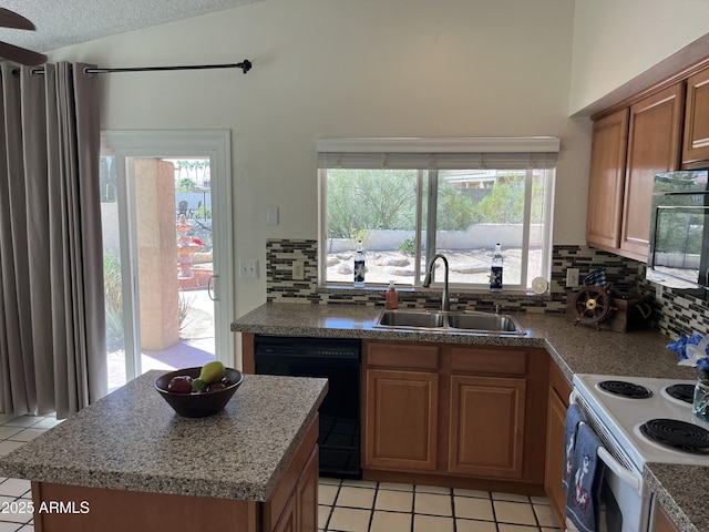 kitchen featuring white electric range oven, vaulted ceiling, a textured ceiling, a sink, and dishwasher