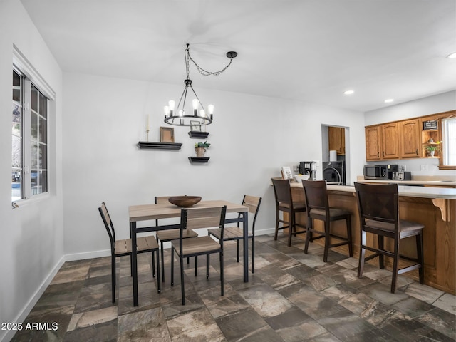 dining space featuring an inviting chandelier