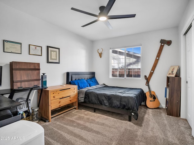 bedroom with carpet flooring, ceiling fan, and a closet