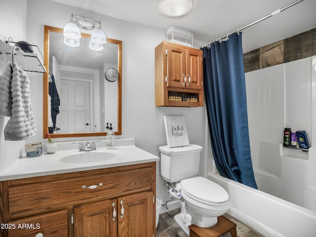 full bathroom with vanity, shower / tub combo, and toilet