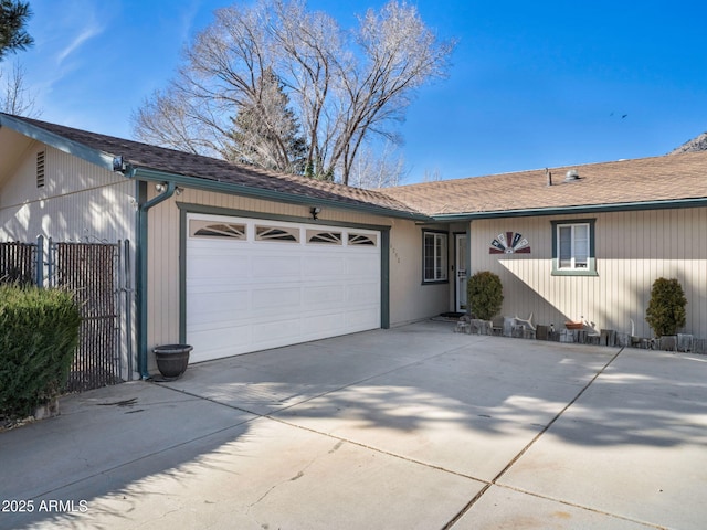 ranch-style home featuring a garage