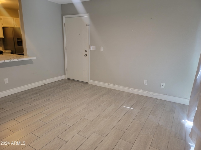 unfurnished living room with light wood-type flooring