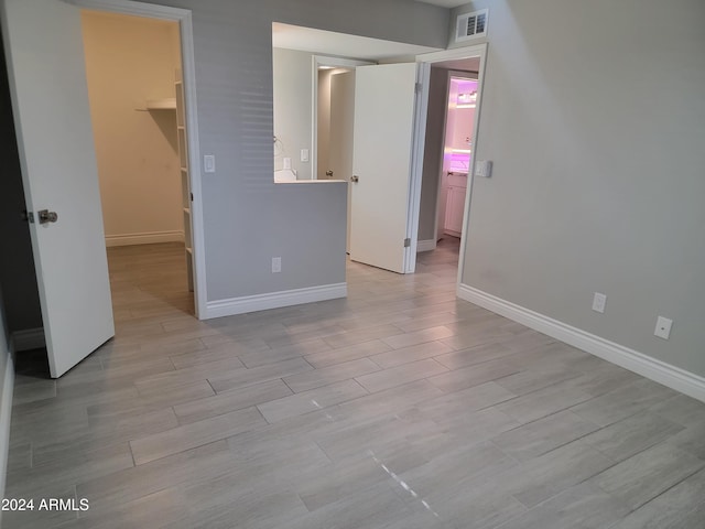 spare room featuring light hardwood / wood-style flooring