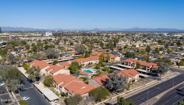 birds eye view of property featuring a mountain view