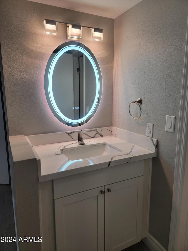 1942 S Emerson Unit 131, Mesa, AZ 85210 - bathroom featuring vanity and a textured wall