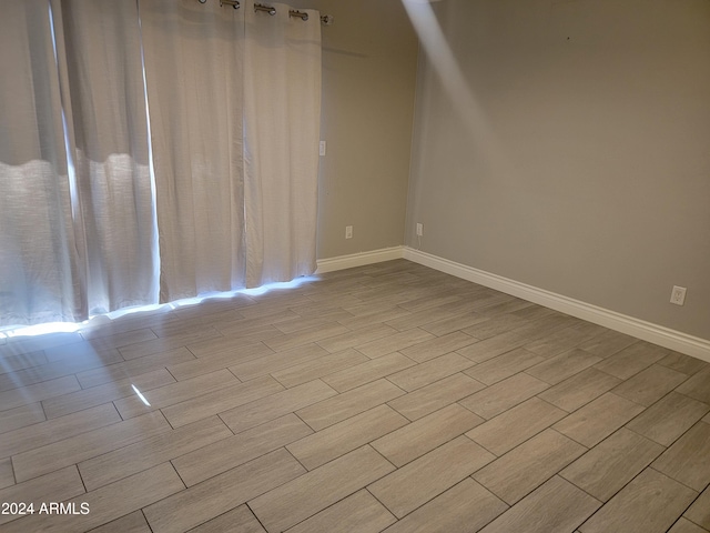 1942 S Emerson Unit 131, Mesa, AZ 85210 - unfurnished room featuring wood finish floors and baseboards