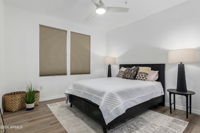 bedroom featuring hardwood / wood-style floors and ceiling fan