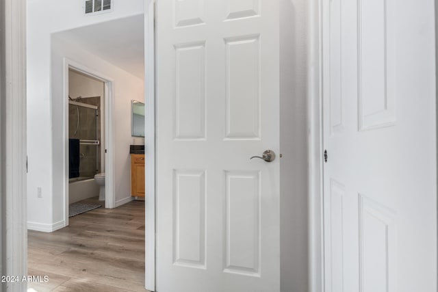 hall with light hardwood / wood-style flooring