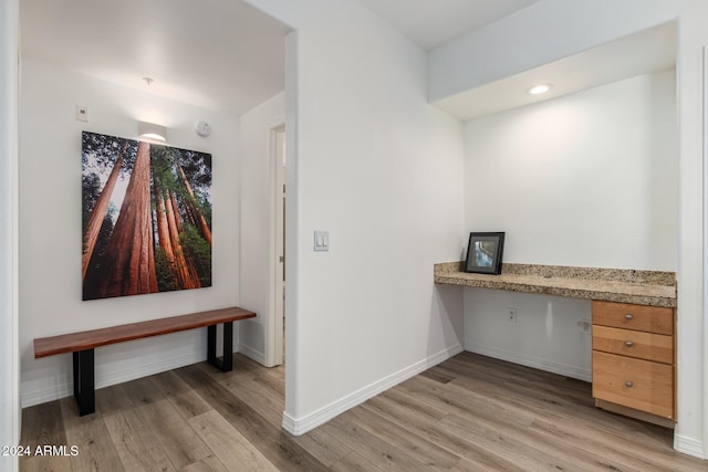 corridor with light wood-type flooring