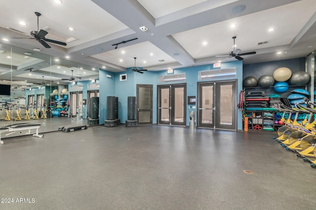 exercise room featuring coffered ceiling and french doors