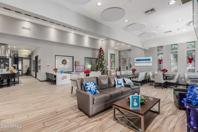 living room with light hardwood / wood-style flooring