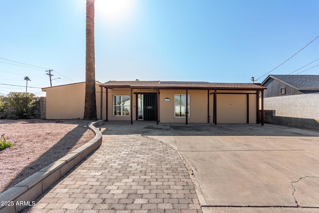 ranch-style house featuring a garage