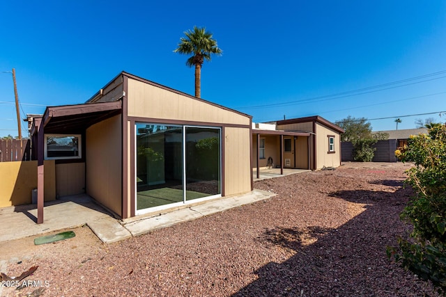 back of property featuring a patio