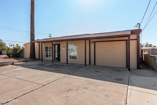 single story home with a garage