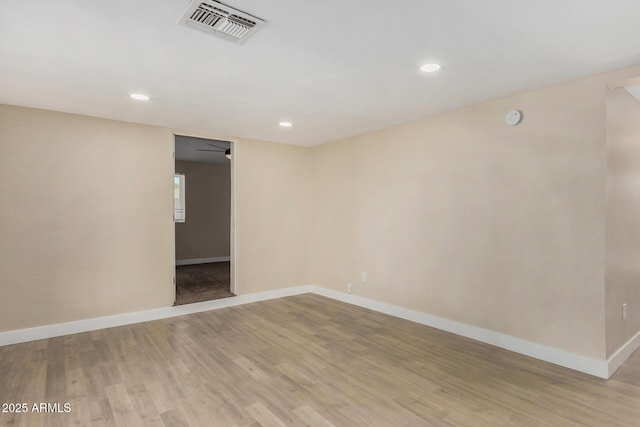 unfurnished room with light wood-type flooring