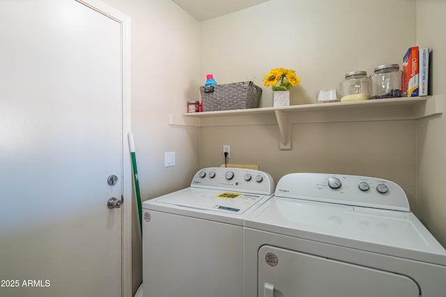 clothes washing area with separate washer and dryer