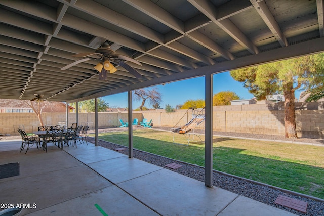 view of patio / terrace featuring a playground and ceiling fan