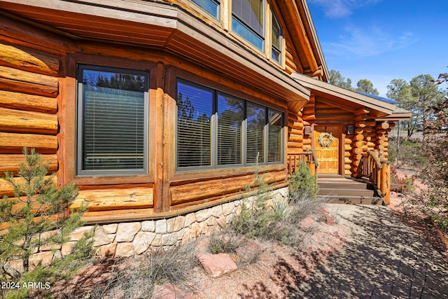 view of side of property with a porch