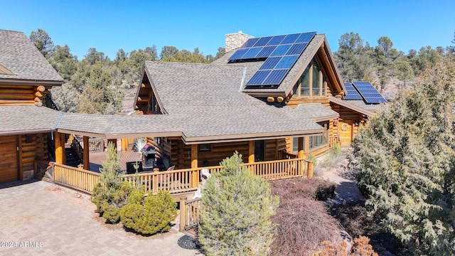 log home with solar panels