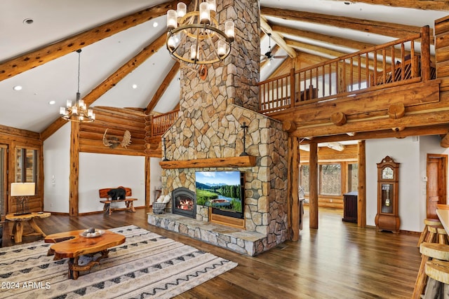 living room featuring a notable chandelier, a fireplace, dark hardwood / wood-style floors, and high vaulted ceiling