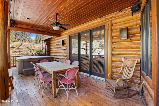 wooden deck featuring ceiling fan, a hot tub, and french doors