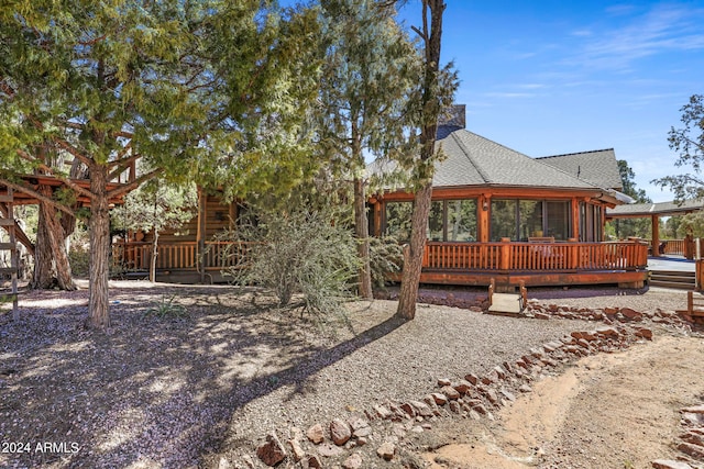 view of side of property with a deck