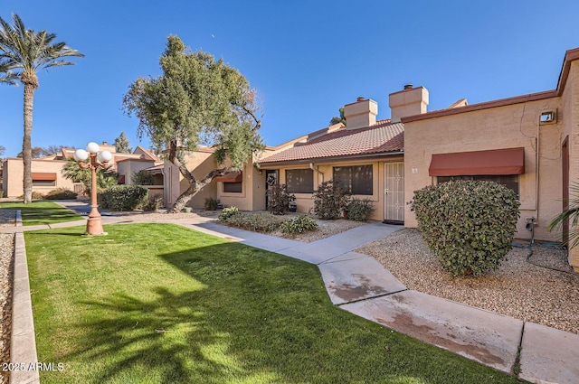 exterior space featuring a front lawn