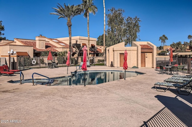 view of swimming pool with a patio