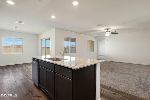 kitchen with dishwasher, open floor plan, a sink, and visible vents