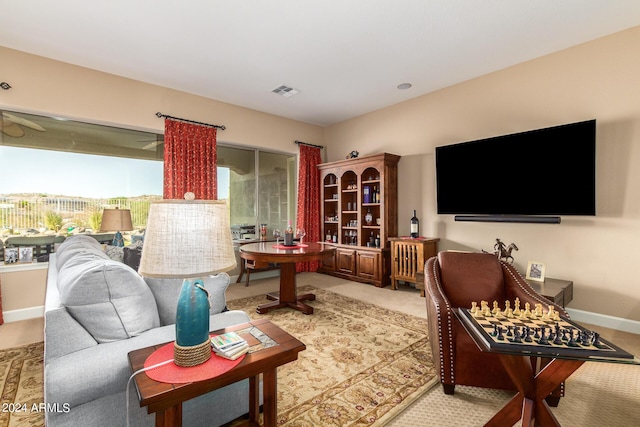 living area with visible vents and baseboards