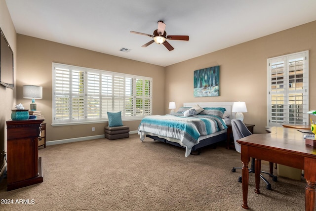 bedroom featuring visible vents, carpet flooring, a ceiling fan, and baseboards