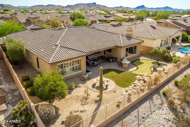 birds eye view of property with a residential view and a mountain view