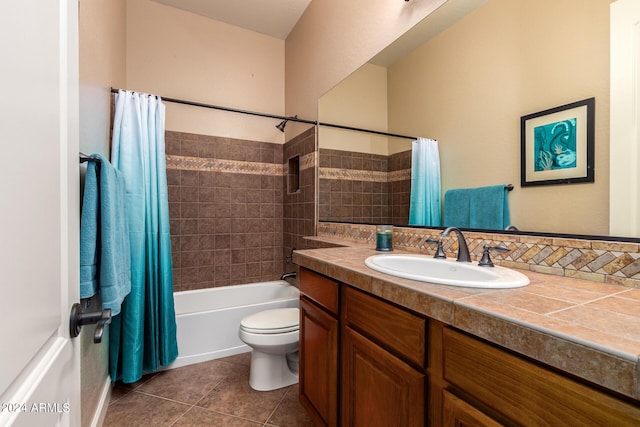 full bath with toilet, shower / bath combination with curtain, vanity, and tile patterned flooring