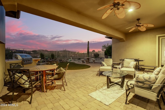 view of patio with ceiling fan, outdoor dining area, a grill, and a fenced backyard