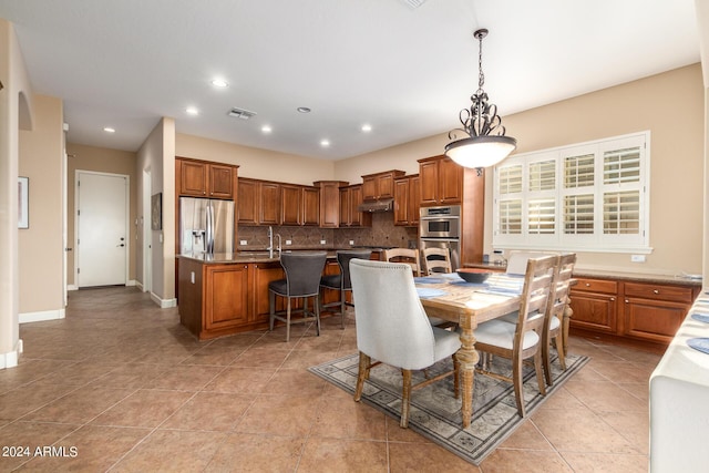 dining space featuring light tile patterned floors, recessed lighting, visible vents, and baseboards