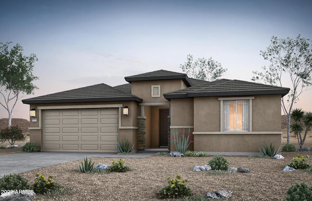 prairie-style house featuring a garage