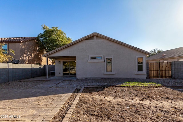 rear view of house with a patio