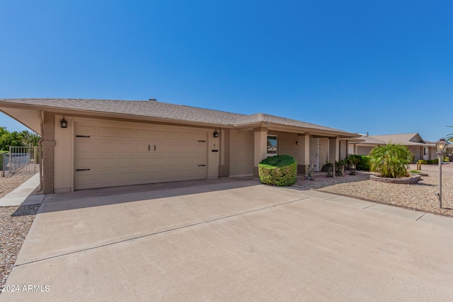 ranch-style home featuring a garage